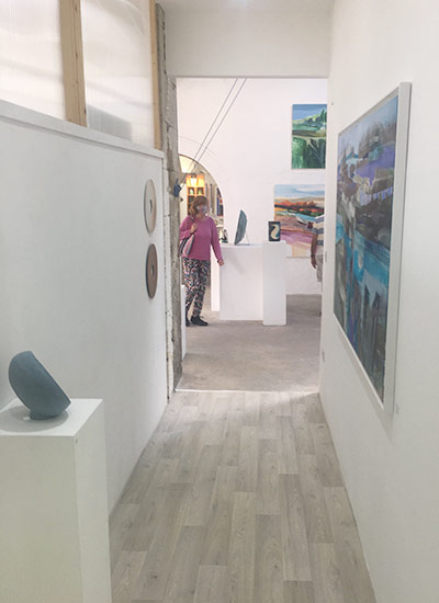 View down one of the corridors displaying art at Binnel Studios