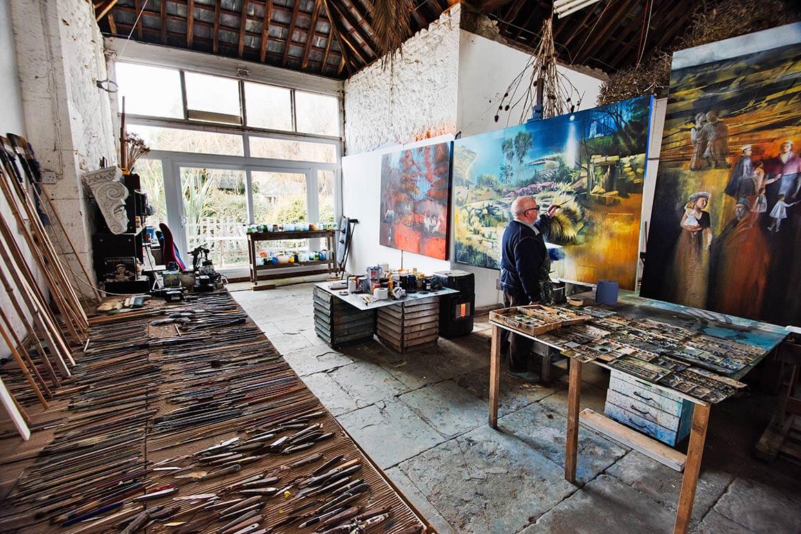 Wide shot of David Firmstone working in gallery space