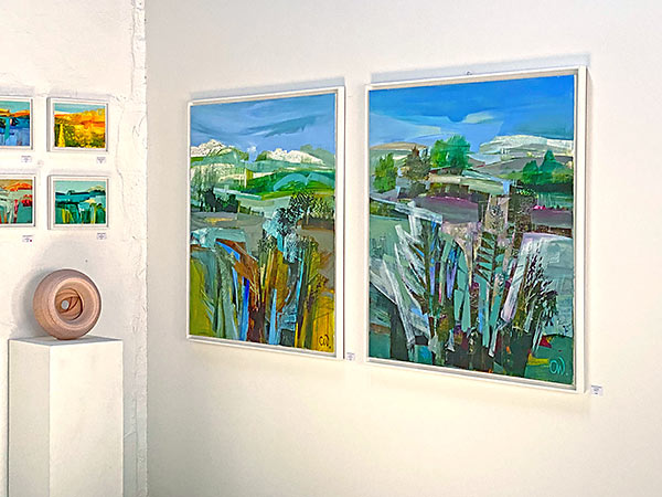 Close up on some of the painting exhibits displayed in the Summer 2022 exhibition